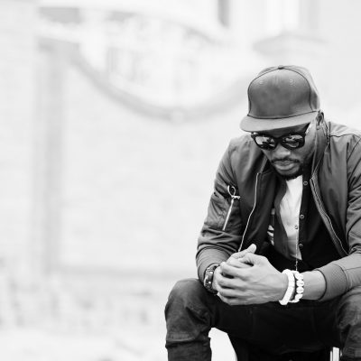 Close up portrait of stylish african american man wear on sunglasses and cap outdoor. Street fashion black man.
