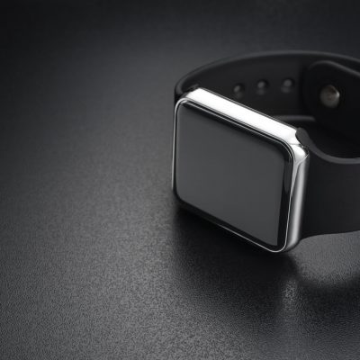 Smart wrist watches on black background with empty space for your text