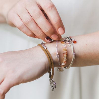 Woman hands with different bracelets and jewellery